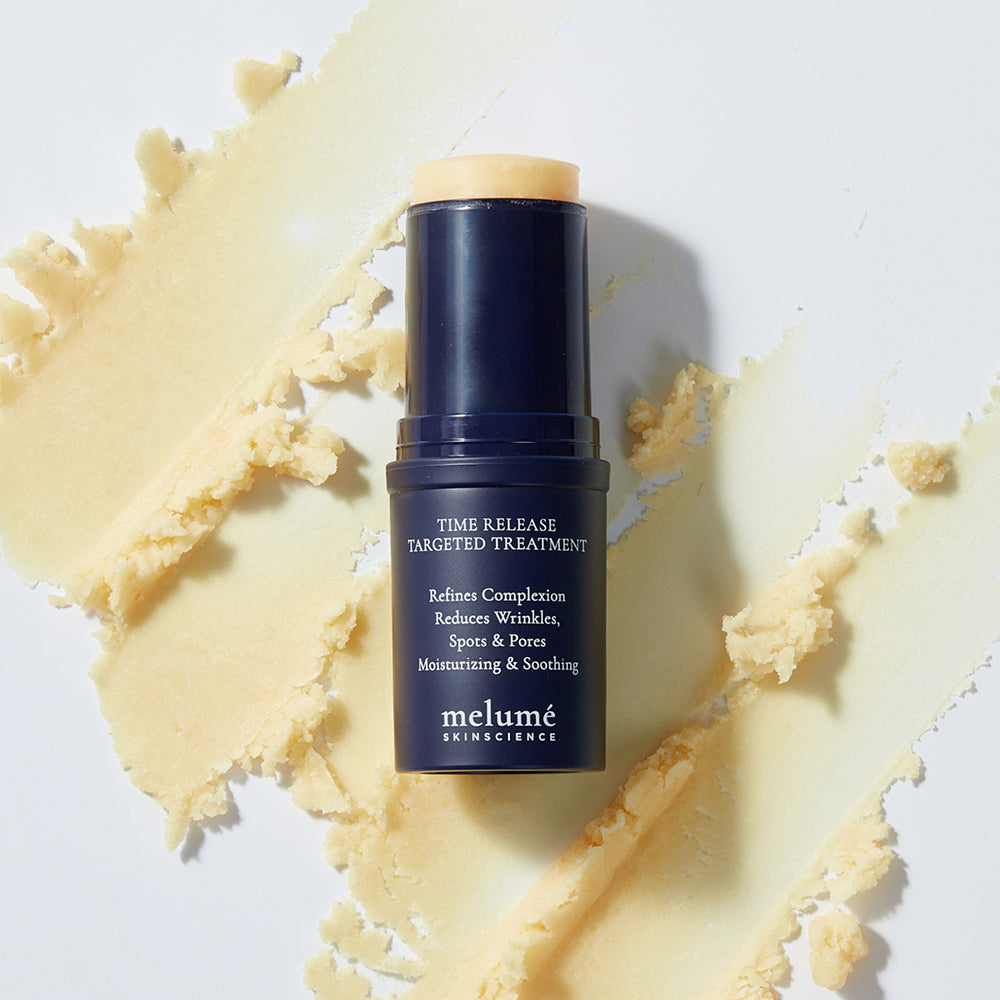 image mood of microencapsulated retinol stick laying over spreaded texture of the retinol stick