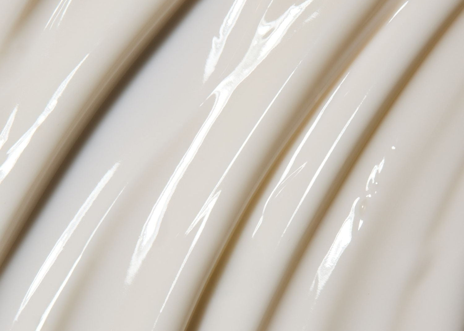Close-up of glossy white texture of power peptide micro emulsion