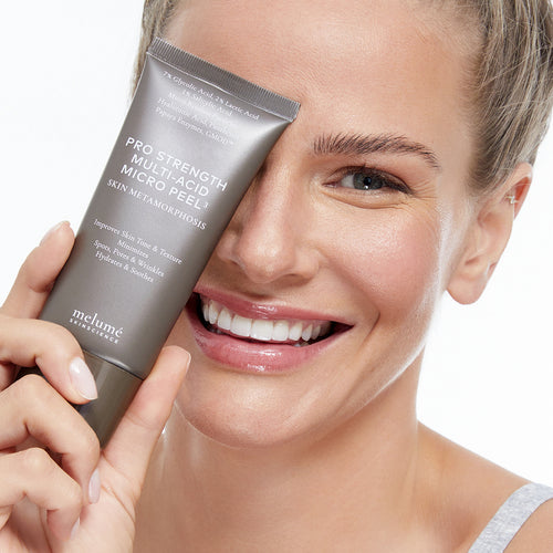 Bild 1 in Galerieansicht laden. image mood of holding pro strength multi-acid micro peel in her hand while smiling