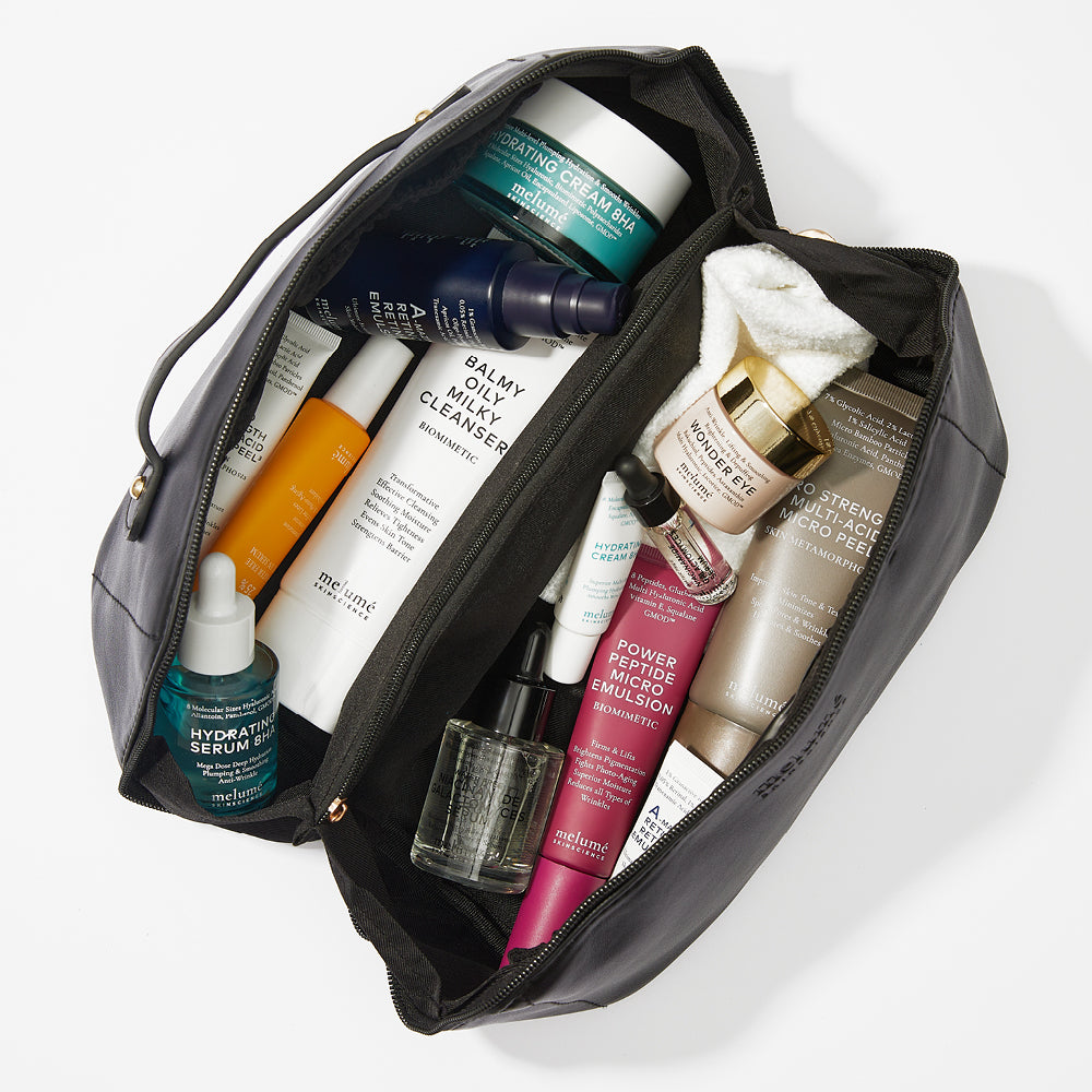 image mood of black vegan beauty bag filled with melume skinscience skincare products