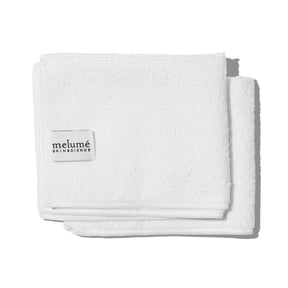 Image of close-up of the two cloths without the packaging. Logo visible on the left side.